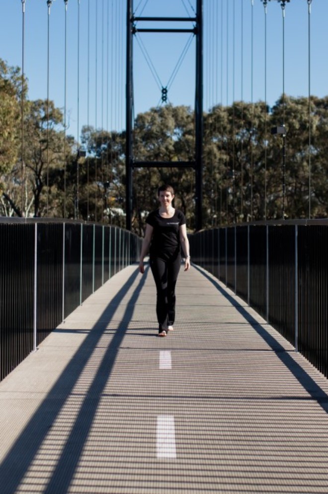 Ali standing of footbridge